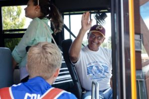 James Bryant welcomes students onto his school bus
